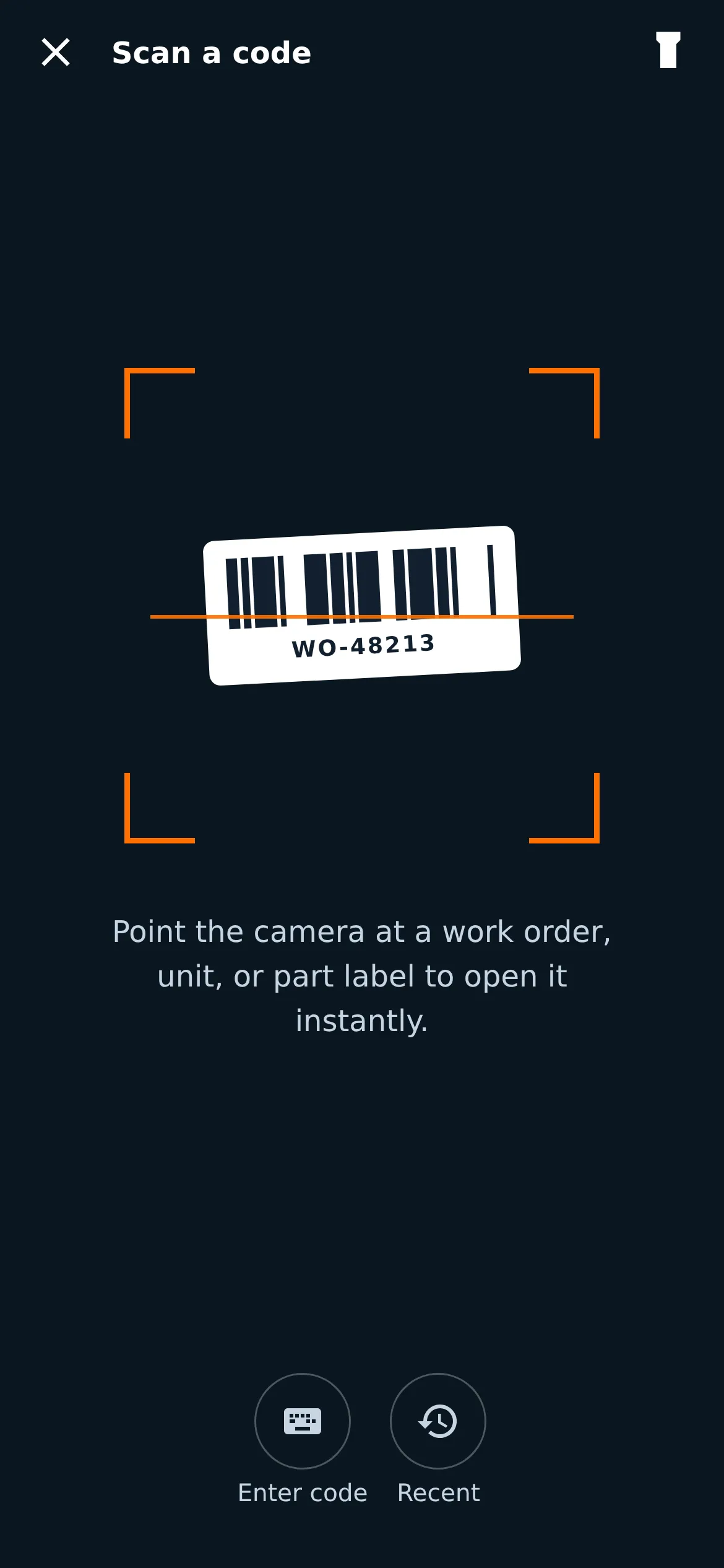 The scan screen: a dark, high-contrast camera view framing a work-order barcode, with an Enter code manual-entry control and a Recent list, so the flow is completable without the camera.